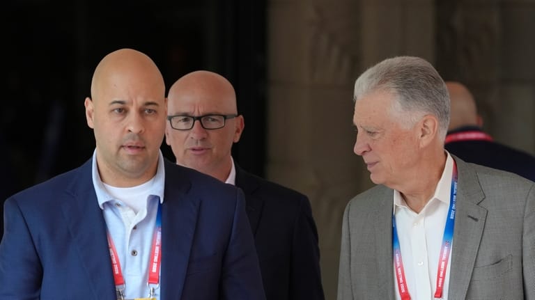 Pittsburgh Steelers owner Art Rooney II, right, walks with Steelers...