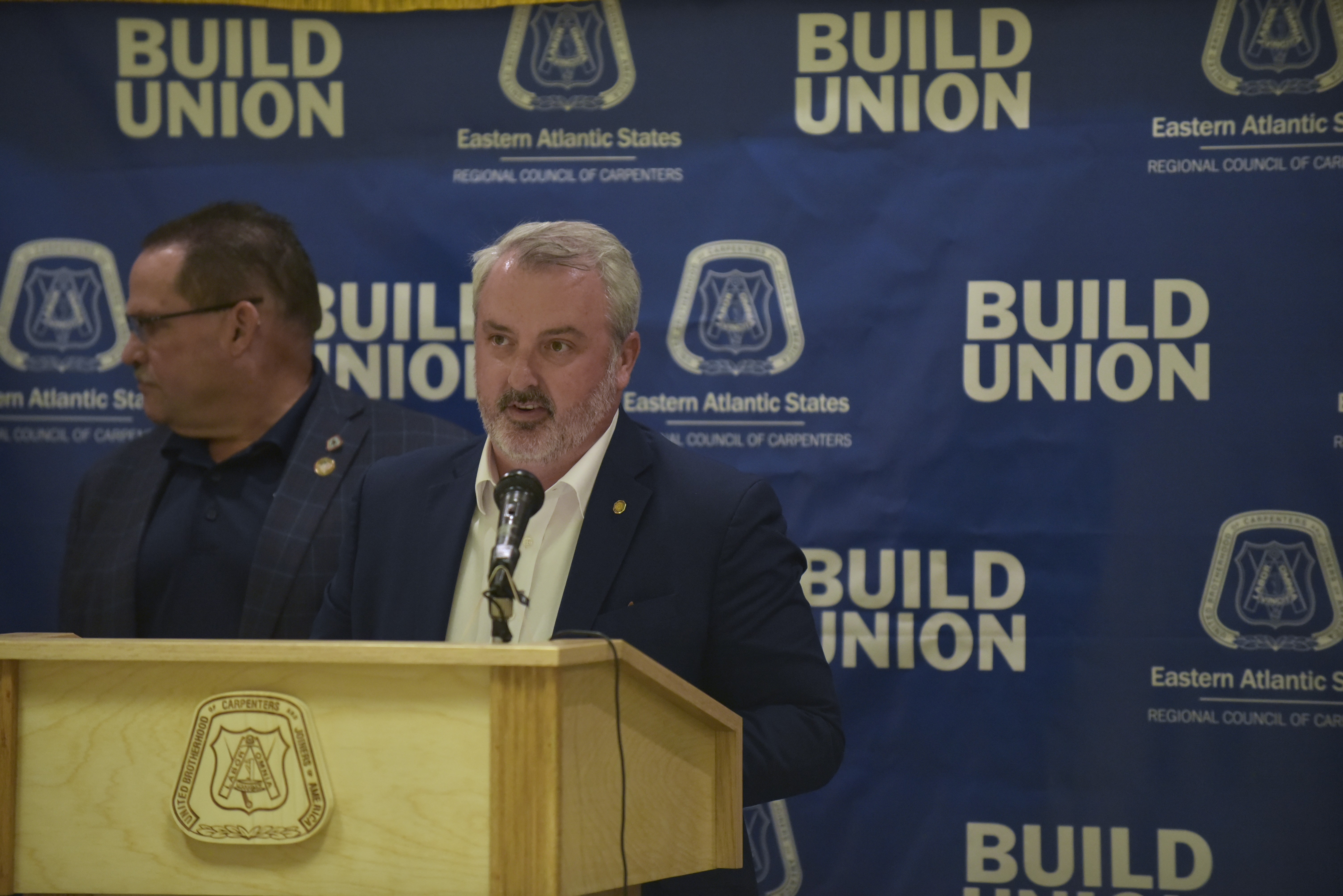 State Rep. Kyle Donahue, D-113, Scranton, addresses union workers and...