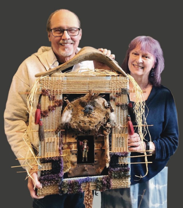 Bob Hakun and Anne Mitchell Reid hold a collaborative work to be included in the invitational exhibition at Studio B. (Courtesy of Studio B)