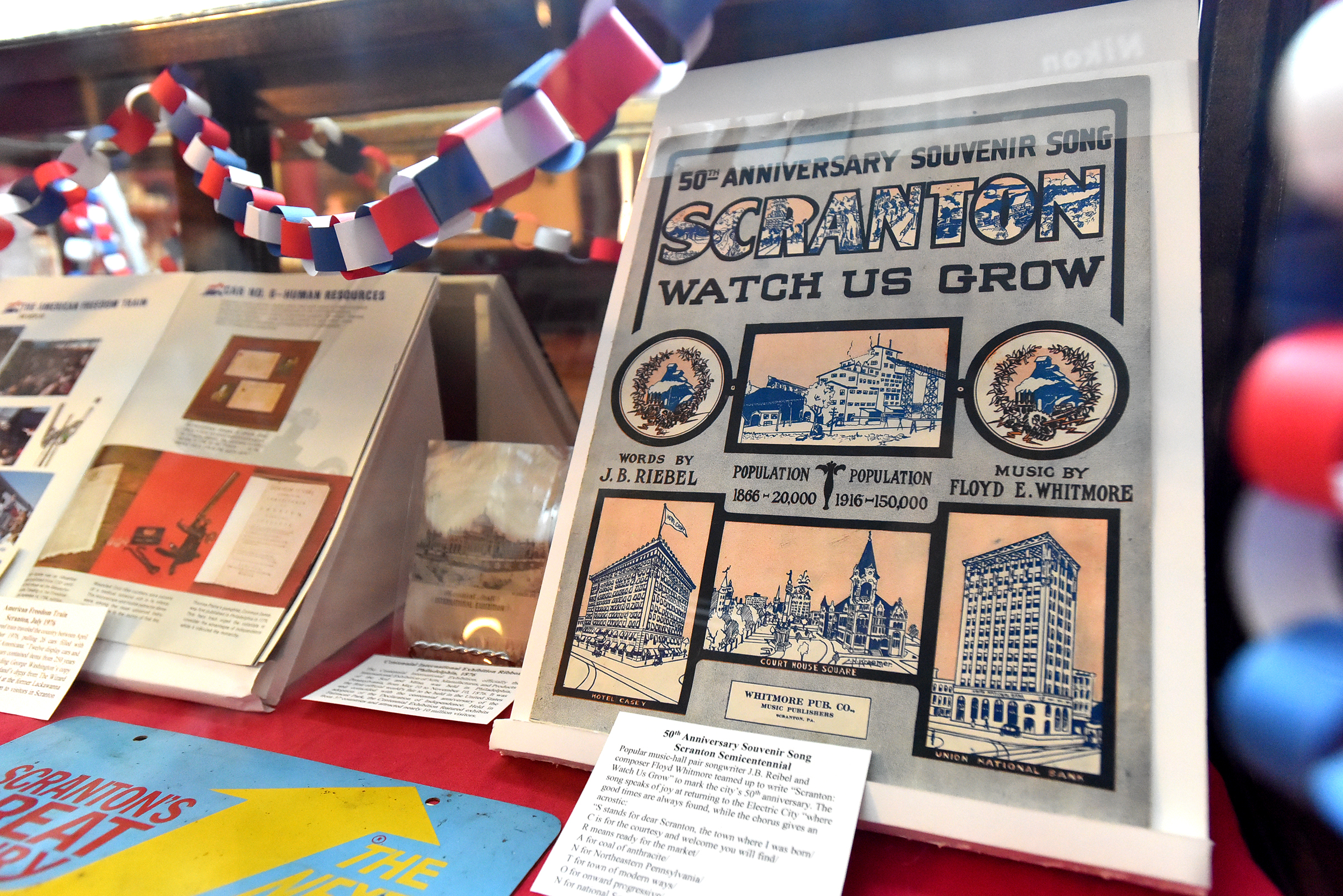Items at celebrate Scranton’s semicentennial from 1916 sits in a...