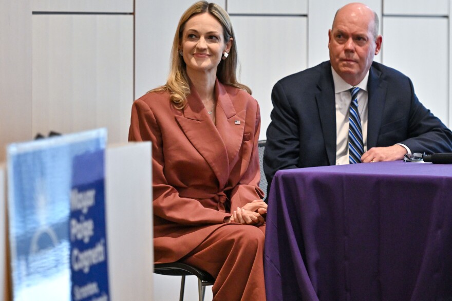 Scranton Mayor Paige Cognetti, left, and Bob Durkin listen to University of Scranton President the Rev. Joseph Marina, S. during the State of the City.