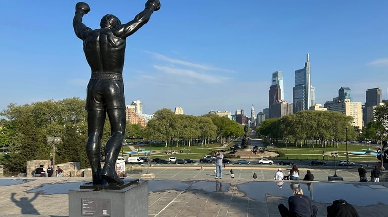 The Rocky statue overlooks the city skyline outside the Philadelphia...