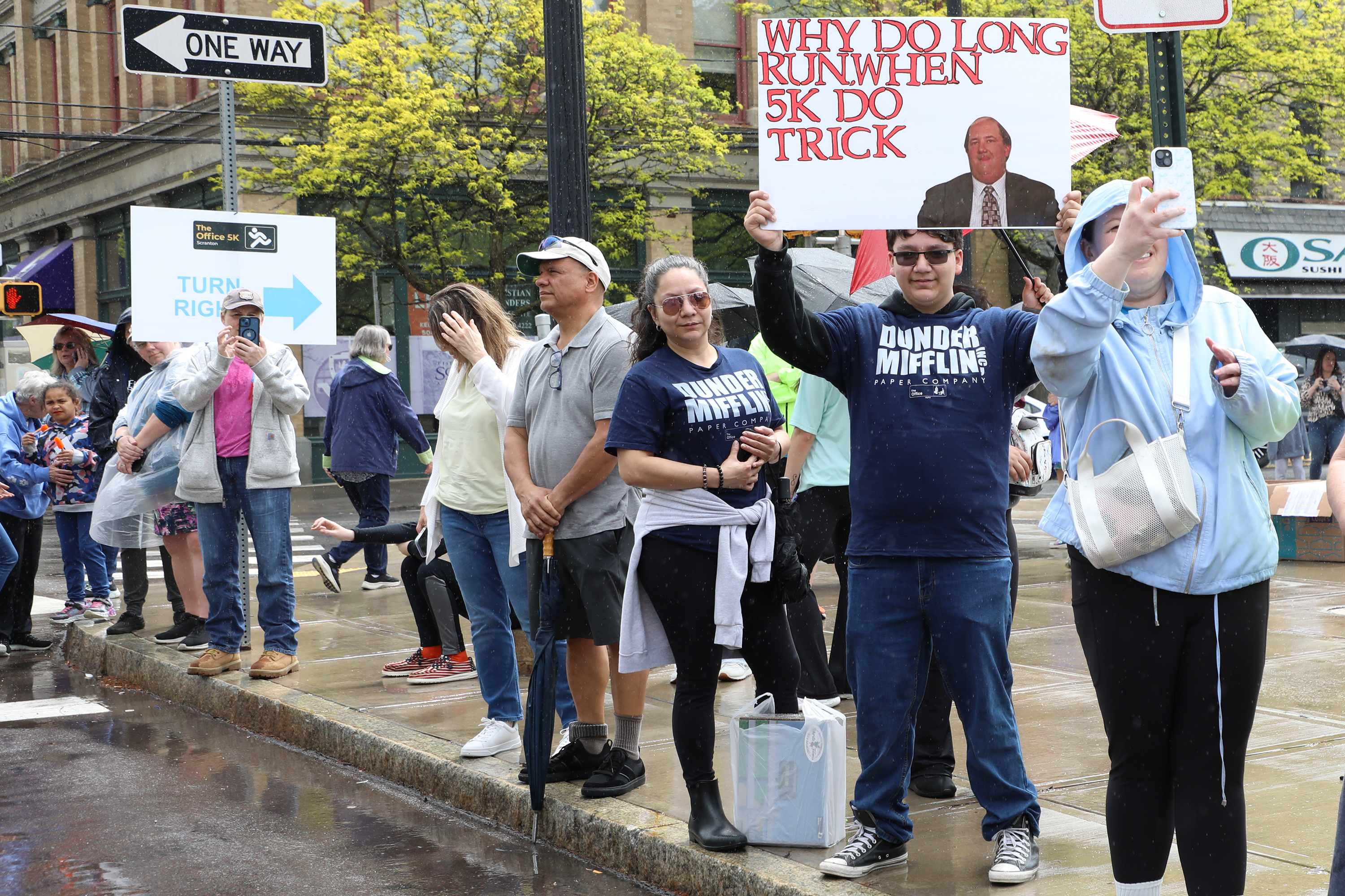 Supporters prepare to cheer on participants before the Office 5K...