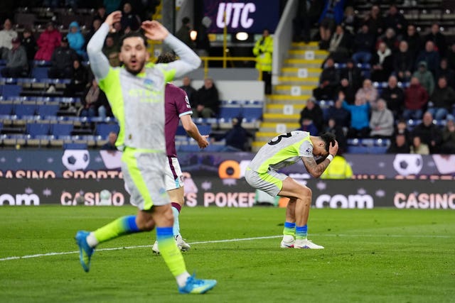 Rayan Cherki, left, and Nico O’Reilly, right, react after a missed opportunity