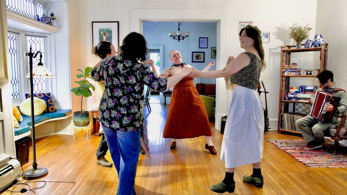 Members of Shtetl Philly dance in a living room