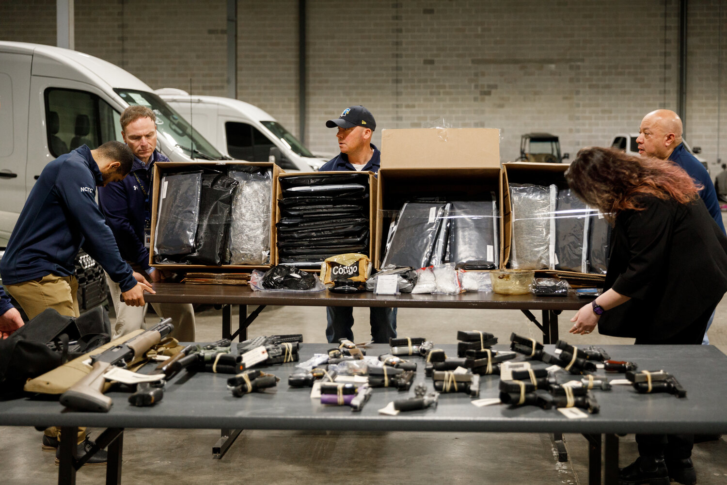 Officials set up evidence collected during the recent Cumberland Street crew raids for a news conference April 1, 2026.