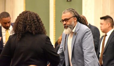 Board of Education President Reginald Streater speaks to Majority Leader Katherine Gilmore Richardson before a City Council budget hearing Wednesday, April 22, 2026.
