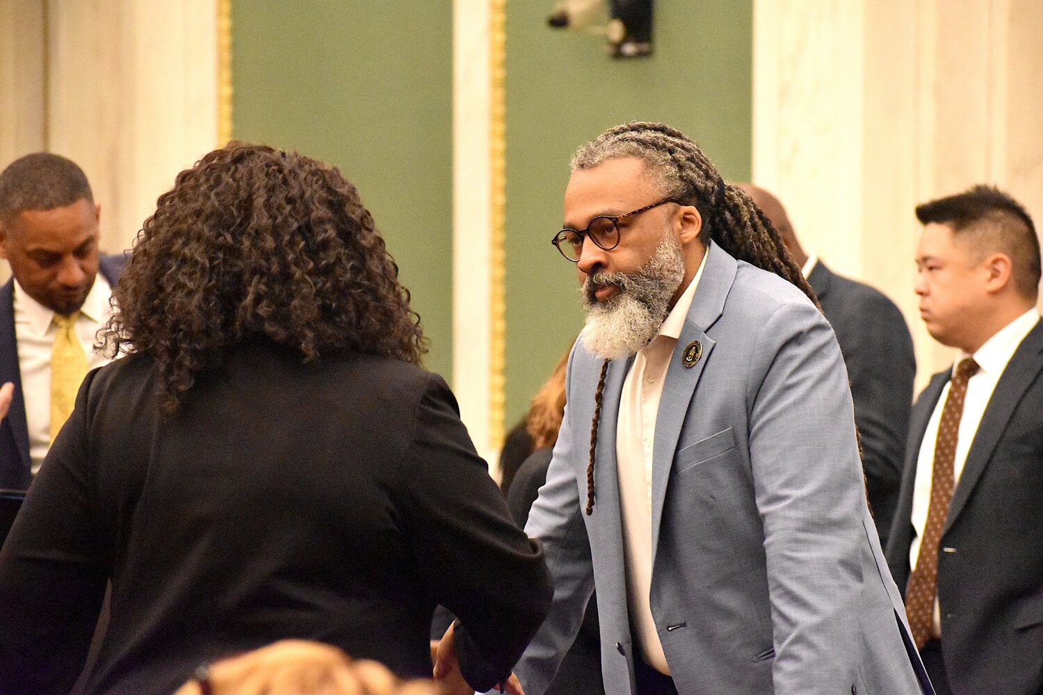 Board of Education President Reginald Streater speaks to Majority Leader Katherine Gilmore Richardson before a City Council budget hearing Wednesday, April 22, 2026.