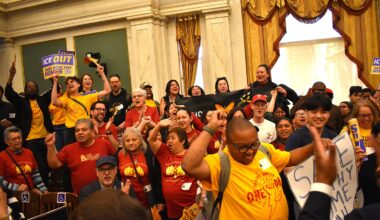 Supporters of the "ICE Out" and "Safe Healthy Homes" legislation celebrate after City Council approved the bills Thursday, April 23, 2026.