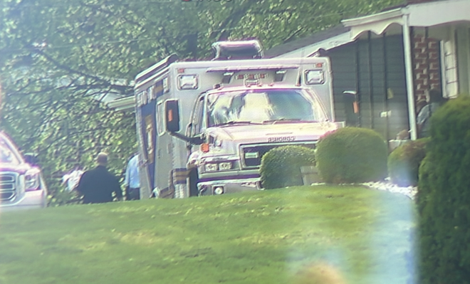 coroner vehicle on scene