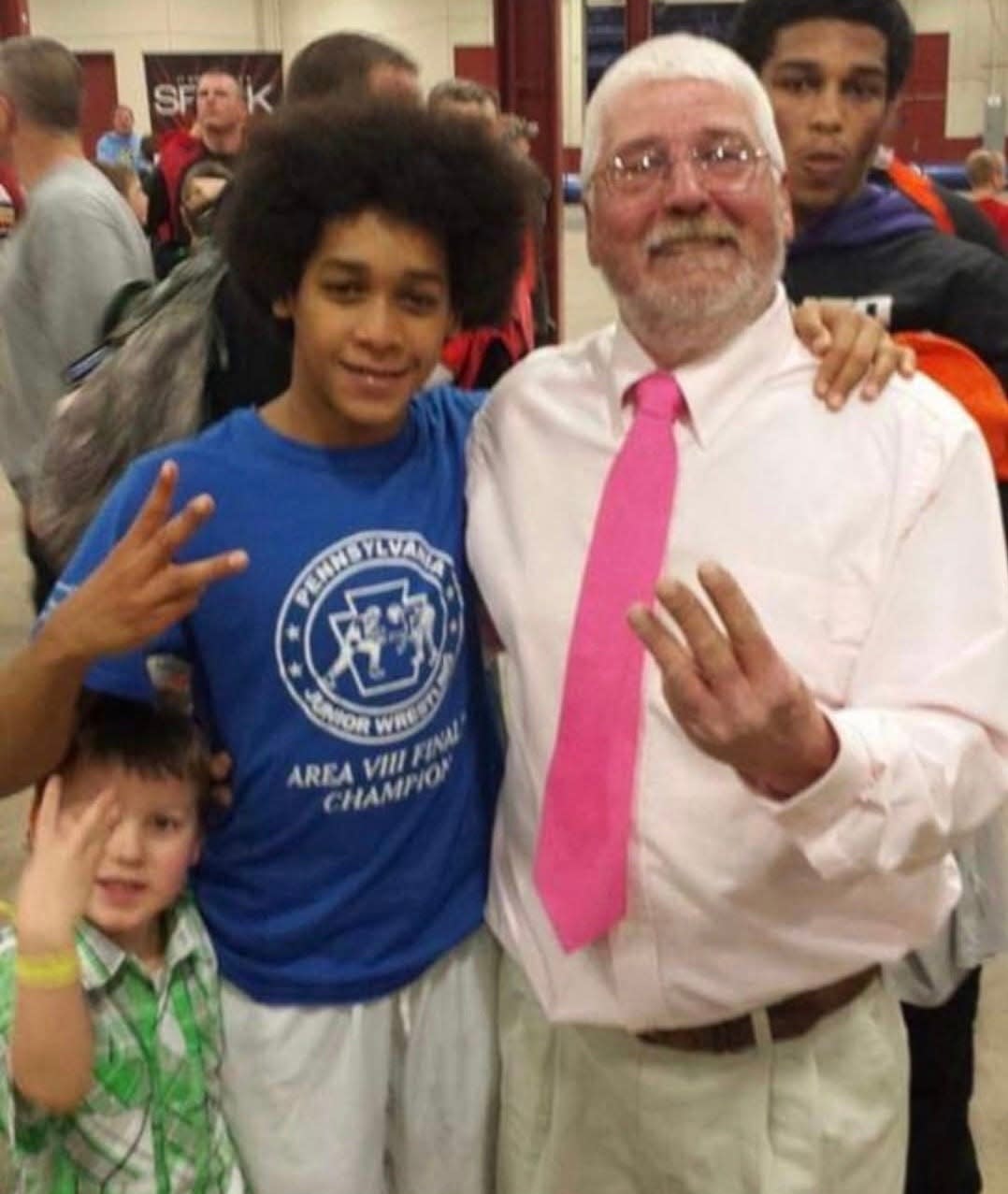 Skip Chatt (right) poses with a young Carter Starocci after coaching the future Penn State Nittany Lion to a Pennsylvania Junior Wrestling (PJW) state championship.