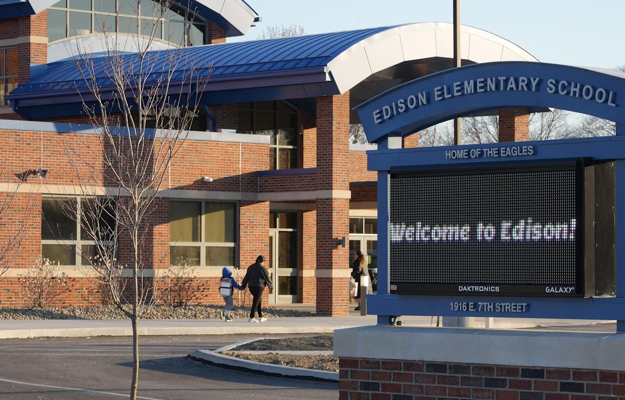 Edison Elementary School students enter the new building for the first time, after Easter break.
