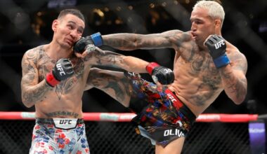 Charles Oliveira (right) punches Max Holloway in a lightweight fight during UFC 326 in March. UFC will be back in Philly in August for it's first title bout in 15 years.