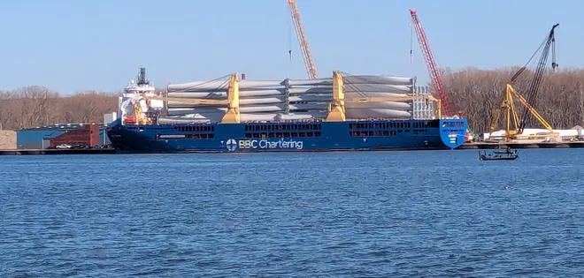 Blades for wind turbines are offloaded at the Port of Erie in Presque Isle Bay on April 11.