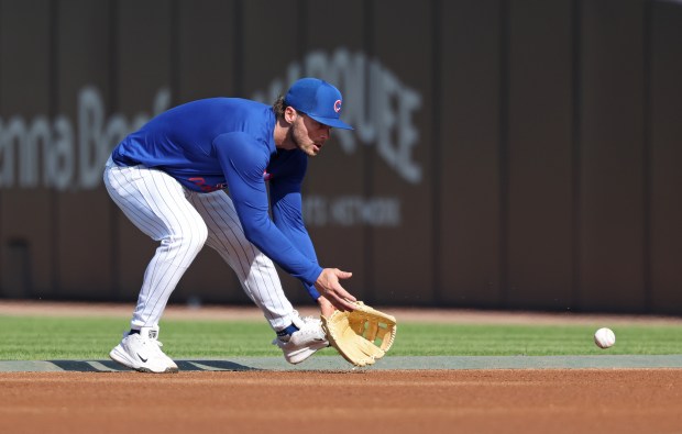 Cubs second baseman Nico Hoerner warms up for a game against the Phillies at Wrigley Field on April 22, 2026, in Chicago. (John J. Kim/Chicago Tribune)