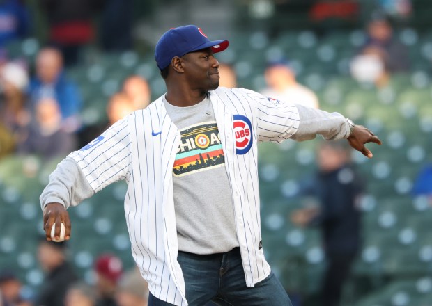 Former Chicago Bears player Jerry Azumah throws a ceremonial first pitch before a Cubs-Phillies game on April 22, 2026, in Chicago. (John J. Kim/Chicago Tribune)