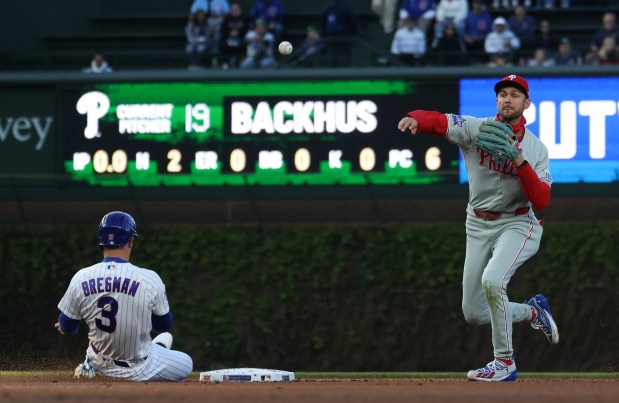 Phillies shortstop Trea Turner throws to first base after forcing out Cubs third baseman Alex Bregman in the first inning at Wrigley Field on April 22, 2026, in Chicago. (John J. Kim/Chicago Tribune)