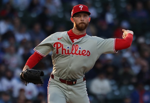 Phillies starting pitcher Kyle Backhus throws to first base against the Cubs in the first inning at Wrigley Field on April 22, 2026, in Chicago. (John J. Kim/Chicago Tribune)