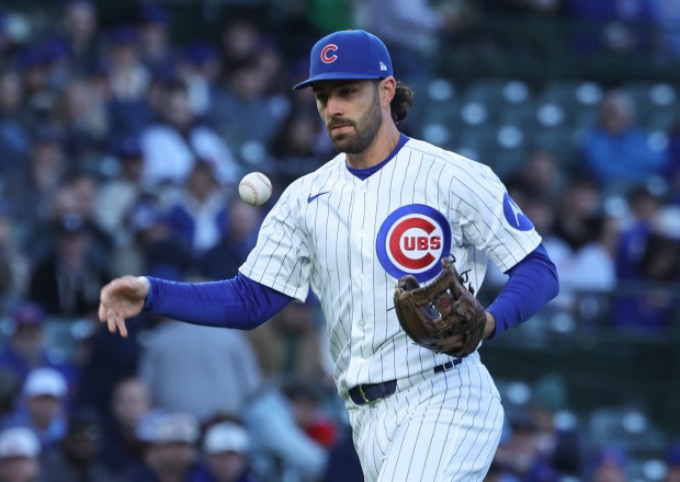 Cubs shortstop Dansby Swanson bobbles the ball while fielding a single by Phillies first baseman Felix Reyes in the second inning at Wrigley Field on April 22, 2026, in Chicago. (John J. Kim/Chicago Tribune)