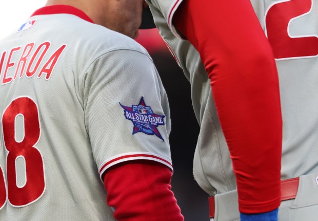 Phillies first base coach Paco Figueroa's uniform displays a 2026 All-Star Game patch, which the Phillies will host, in the second inning against the Cubs at Wrigley Field on April 22, 2026, in Chicago. (John J. Kim/Chicago Tribune)