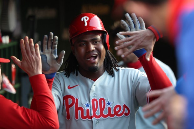 Phillies first baseman Felix Reyes celebrates after scoring on a double from second baseman Edmundo Sosa in the second inning against the Cubs at Wrigley Field on April 22, 2026, in Chicago. (John J. Kim/Chicago Tribune)