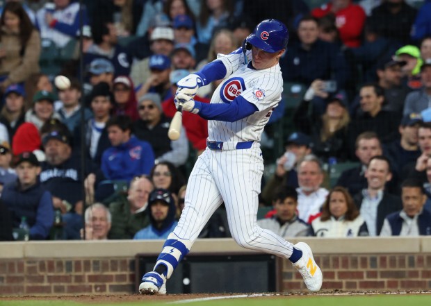 Cubs center fielder Pete Crow-Armstrong connects for an RBI double in the second inning against the Phillies at Wrigley Field on April 22, 2026, in Chicago. (John J. Kim/Chicago Tribune)
