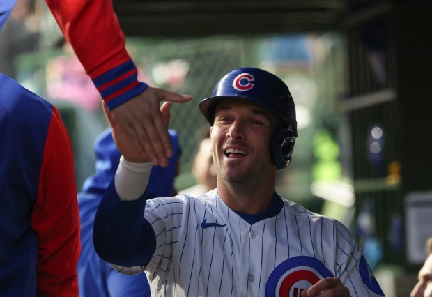 Cubs third baseman Alex Bregman celebrates after scoring on an RBI single from left fielder Ian Happ in the third inning against the Phillies at Wrigley Field on April 22, 2026, in Chicago. (John J. Kim/Chicago Tribune)