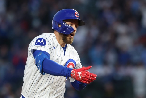 Cubs first baseman Michael Busch rounds the bases after hitting a home run in the third inning against the Phillies at Wrigley Field on April 22, 2026, in Chicago. (John J. Kim/Chicago Tribune)