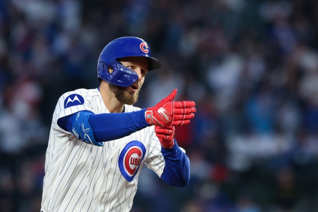 Cubs first baseman Michael Busch rounds the bases after hitting a home run in the third inning against the Phillies at Wrigley Field on April 22, 2026, in Chicago. (John J. Kim/Chicago Tribune)