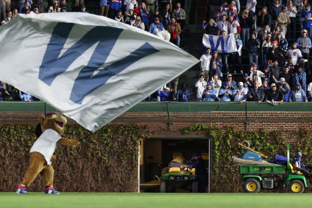 Fans celebrate a 7-2 Cubs win over the Phillies at Wrigley Field on April 22, 2026, in Chicago. (John J. Kim/Chicago Tribune)