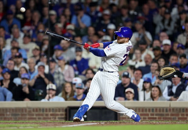 Chicago Cubs first baseman Michael Busch (29) drives in two runs on the single in the sixth inning of a game against the Philadelphia Phillies at Wrigley Field in Chicago on April 21, 2026. (Chris Sweda/Chicago Tribune)