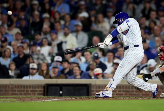 Chicago Cubs right fielder Seiya Suzuki (27) hits a two-run home run in the seventh inning of a game against the Philadelphia Phillies at Wrigley Field in Chicago on April 21, 2026. (Chris Sweda/Chicago Tribune)