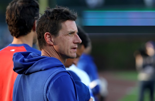 Chicago Cubs manager Craig Counsell (11) stands for the national anthem before taking on the Philadelphia Phillies at Wrigley Field in Chicago on April 21, 2026. (Chris Sweda/Chicago Tribune)