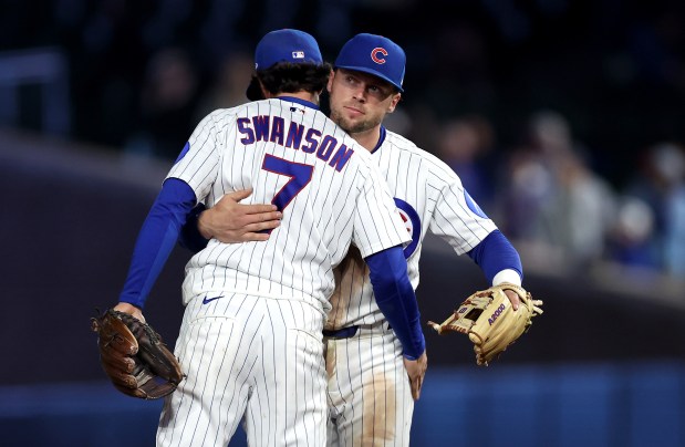 Chicago Cubs shortstop Dansby Swanson (7) and second baseman Nico Hoerner (right) celebrate after a victory over the Philadelphia Phillies at Wrigley Field in Chicago on April 21, 2026. (Chris Sweda/Chicago Tribune)
