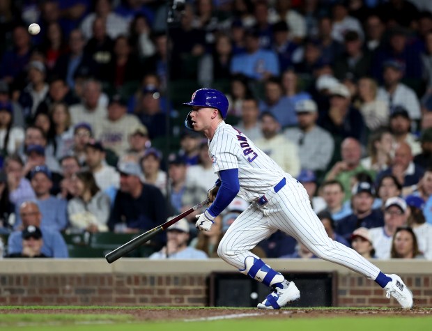 Chicago Cubs center fielder Pete Crow-Armstrong (4) bunts for a single in the eighth inning of a game against the Philadelphia Phillies at Wrigley Field in Chicago on April 21, 2026. (Chris Sweda/Chicago Tribune)