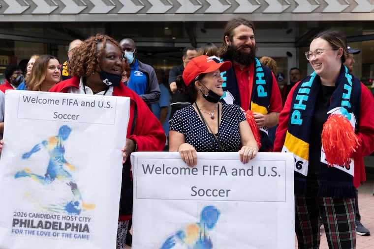 SEPTA employees (from left) Bernadette Foster, Nancy Mazzuca, and Olivia Hopkins attend at a pep rally hosted by the Philadelphia World Cup bid committee to welcome executives from FIFA at 12th and Market on Sept. 22, 2021.