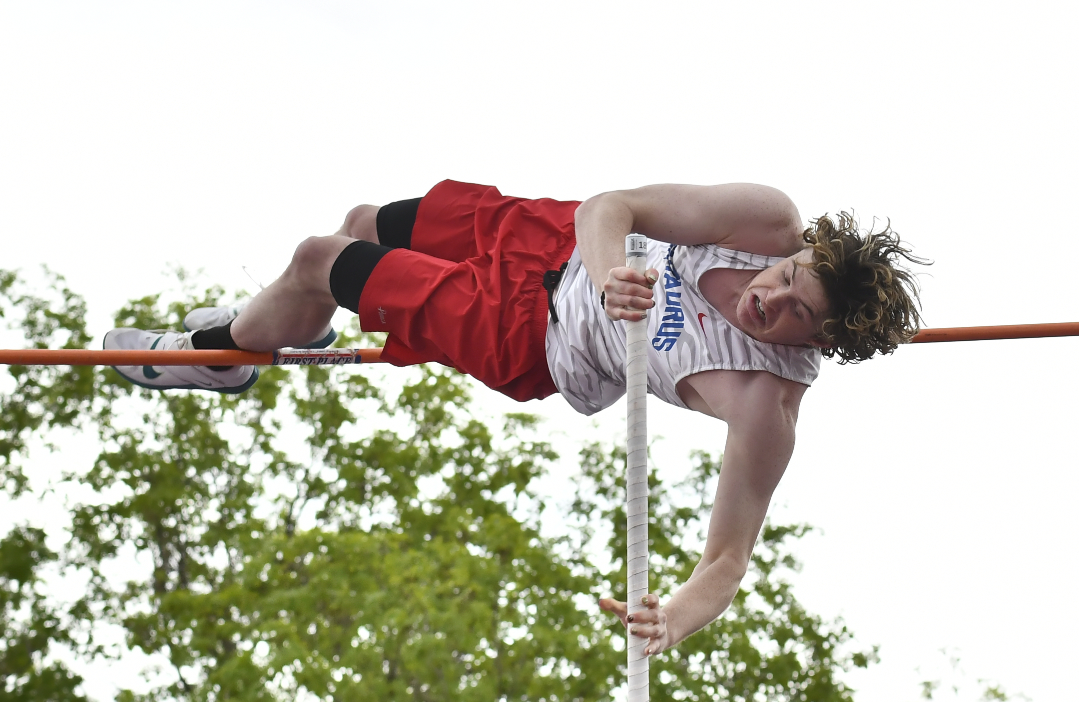 Centaurusâ Eli Shore competes in the pole vault during the...