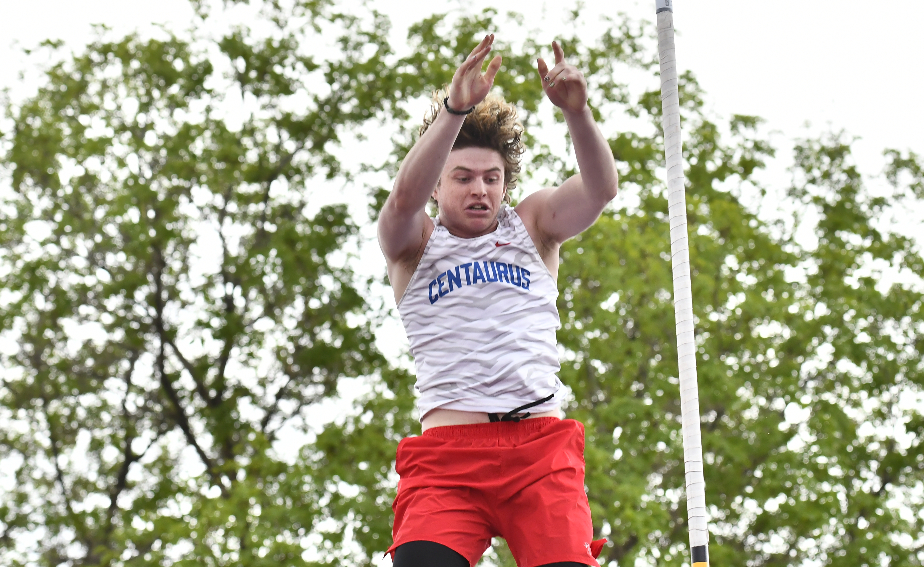 Centaurusâ Eli Shore competes in the pole vault during the...