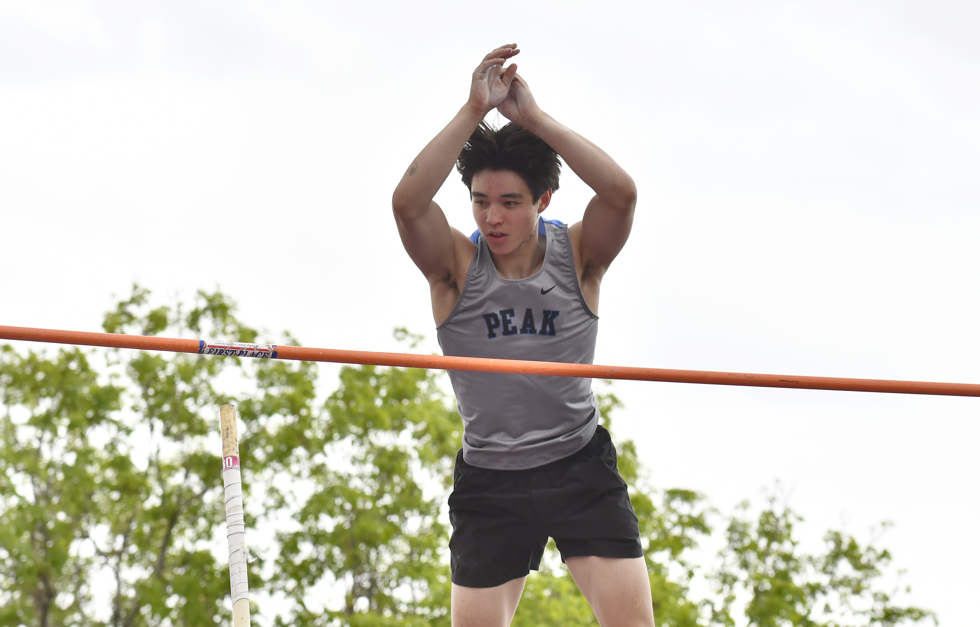 Peak to Peak's Ethan Rathke competes in the pole vault...