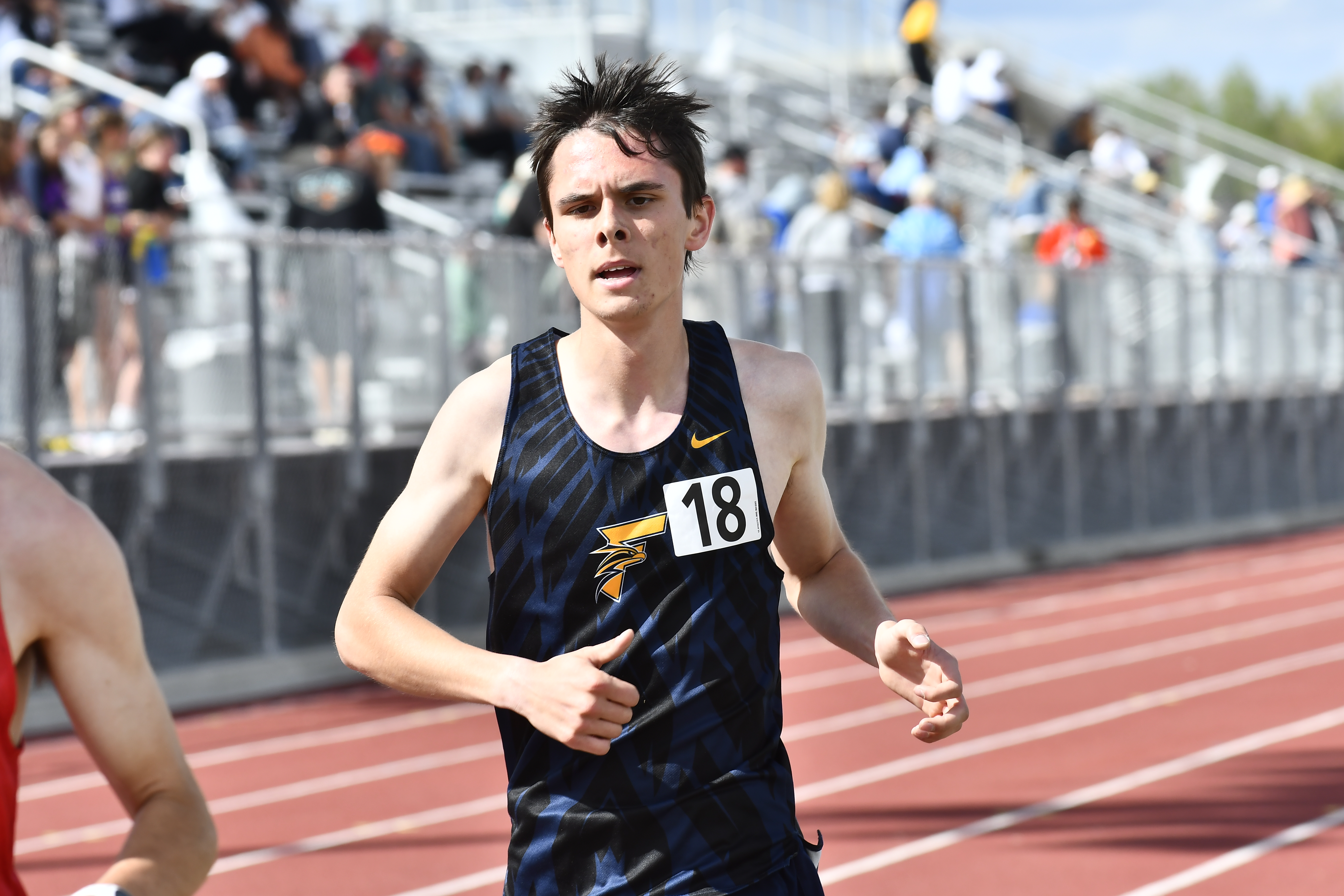Frederick's Josh Cuzner competes in the 3,200-meter run during the...
