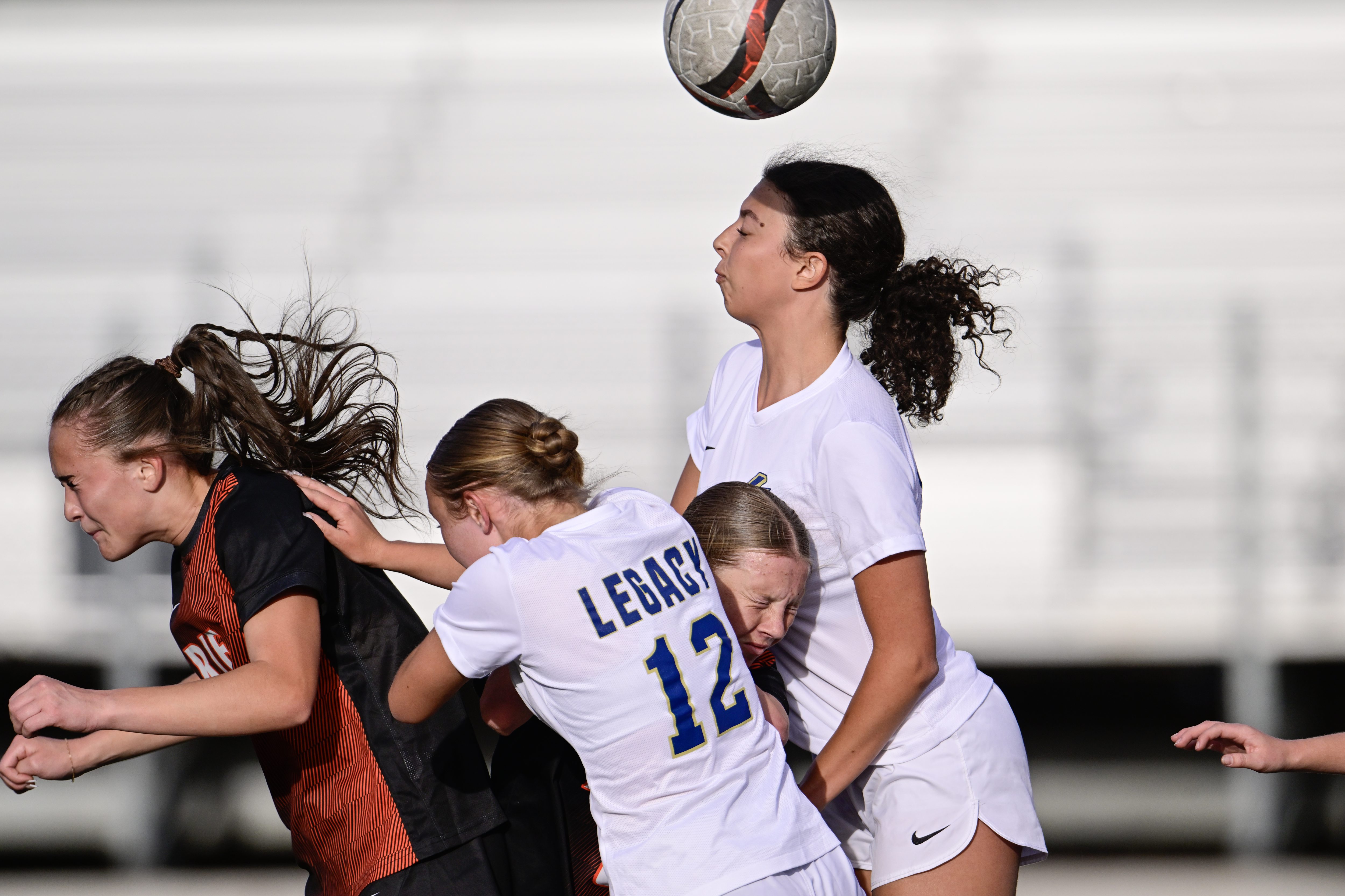 Legacyâs Emma Roedel, right, and Ellie Mikolaj, center left, and...