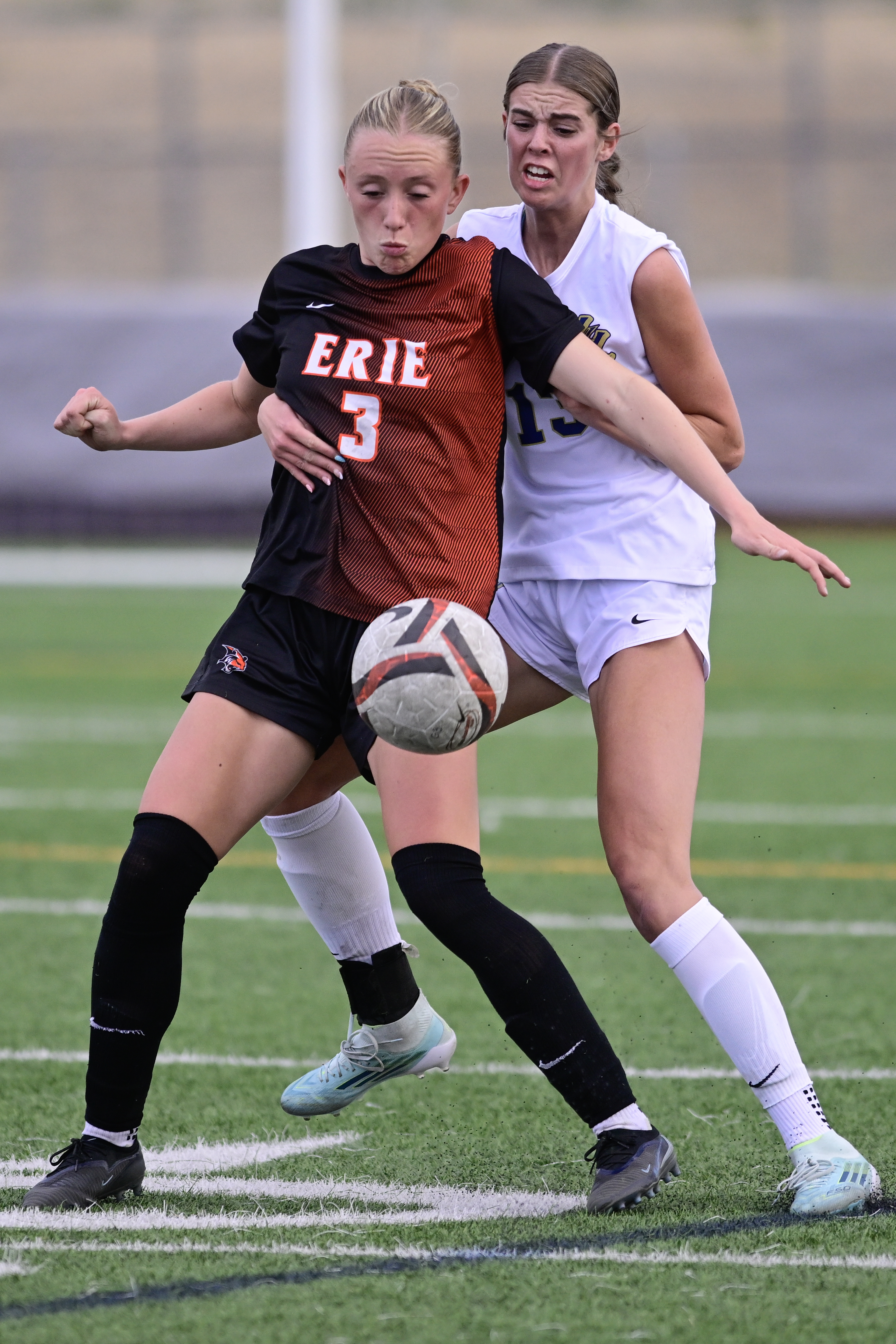 Erieâs Elodie Kirchoffner, left, tries to keep the ball away...