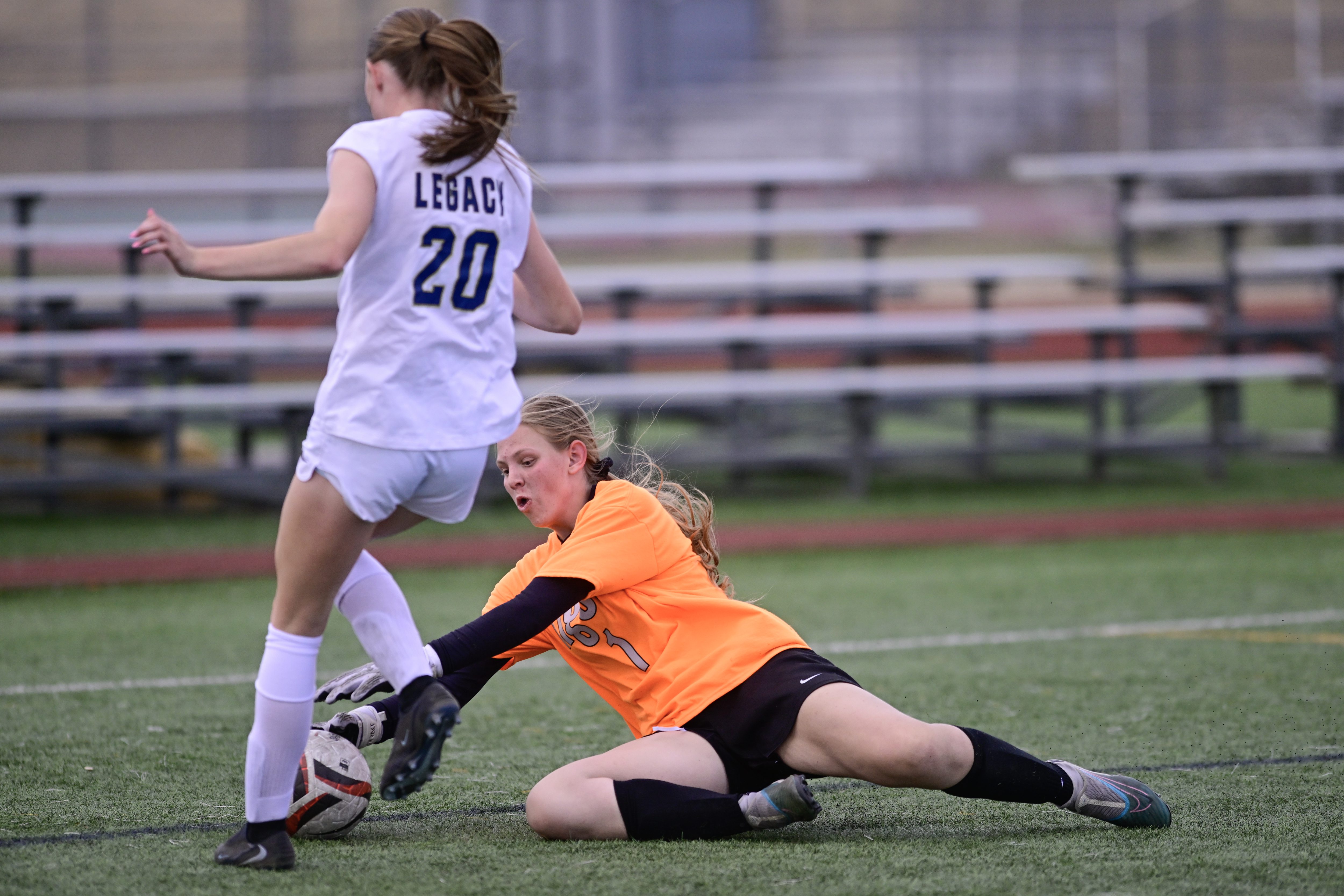 Erieâs Mackenzie Paul, right, makes a save against Legacyâs Jacy...