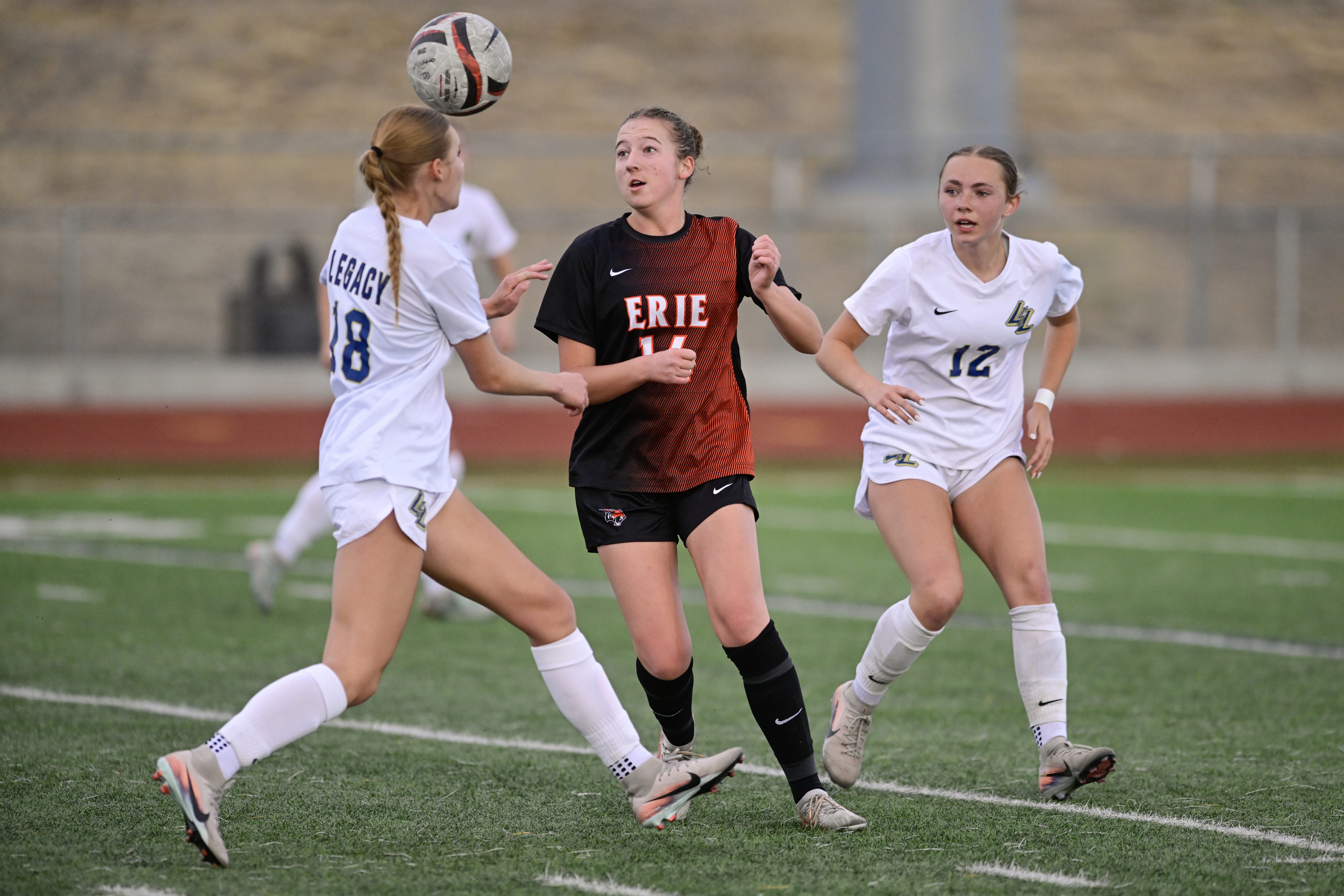 Legacyâs Siena Kidd, left, and Ellie Mikolaj, right, try to...