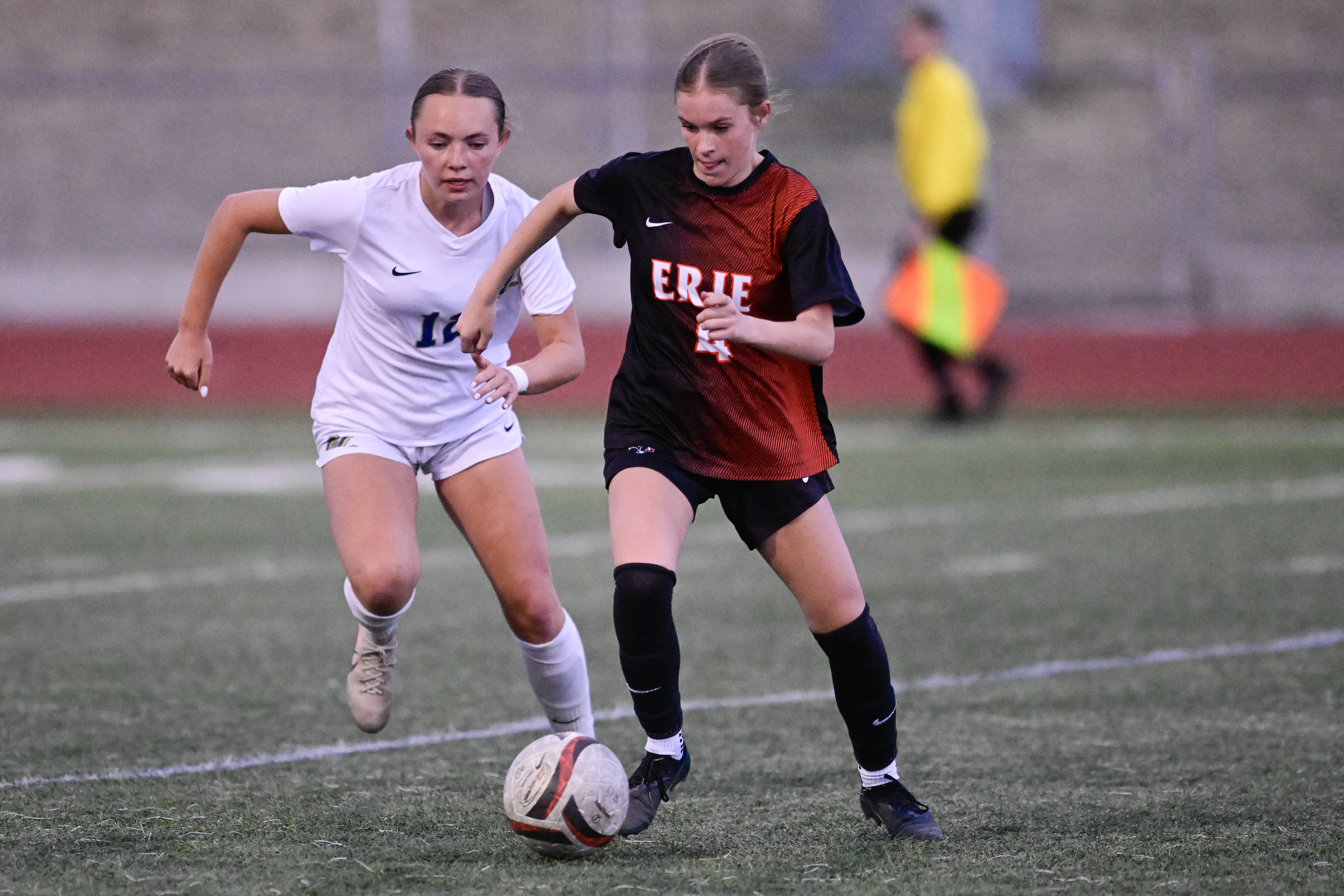 Legacyâs Ellie Mikolaj, left, puts pressure on Erieâs Kate Zogorski,...