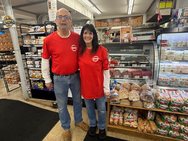 David and Donna Travers, owners of Travers Food Market in Lansdowne, at their deli counter. (PEG DEGRASSA/ DAILY TIMES)