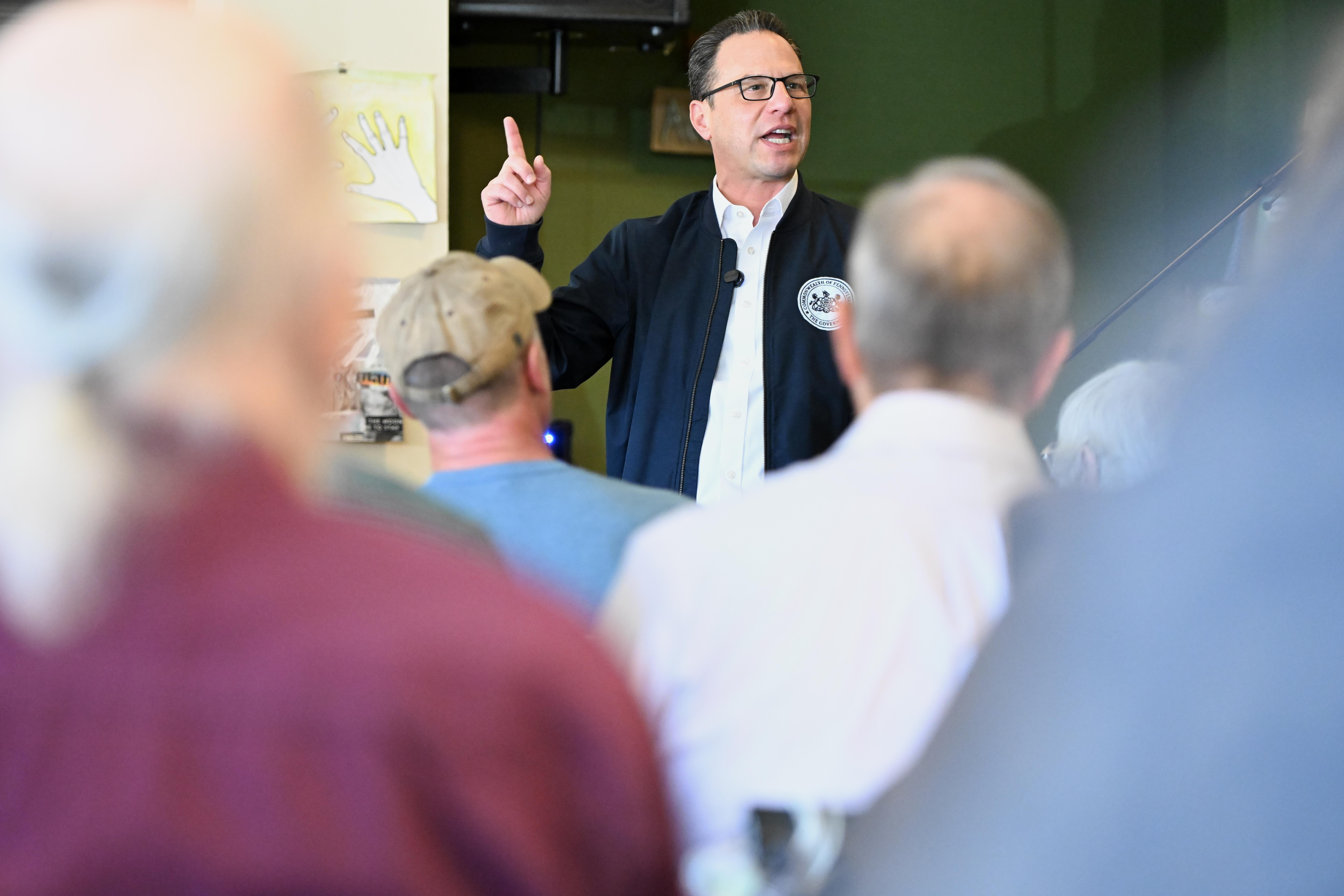 FILE – Pennsylvania Gov. Josh Shapiro speaks to the crowd...