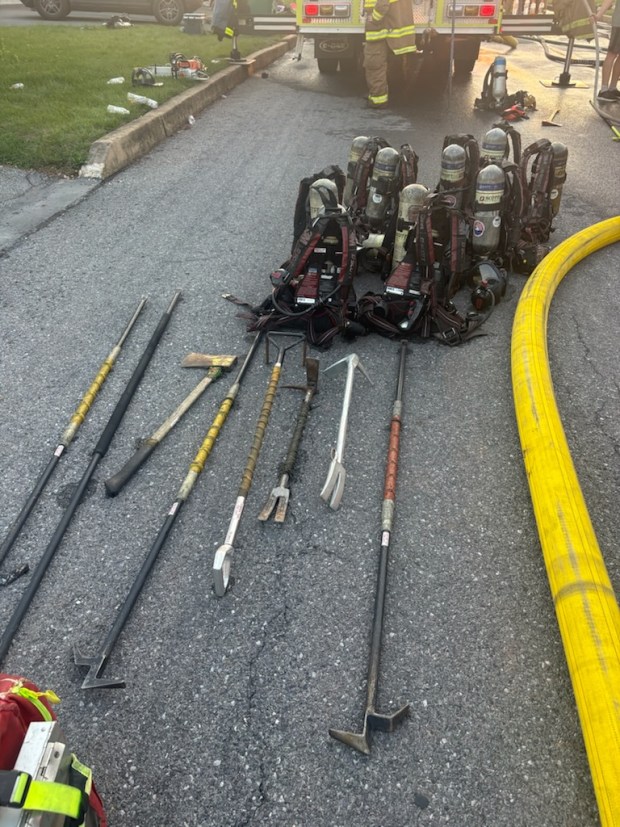 Crews used axes and other tools to gain entry to a burning home on Claire Drive in Exeter. (Courtesy of Chris Roberts)