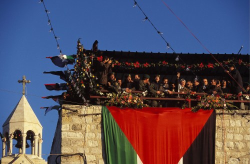 Yasser Arafat, addresses an enthusiastic crowd in Bethlehem