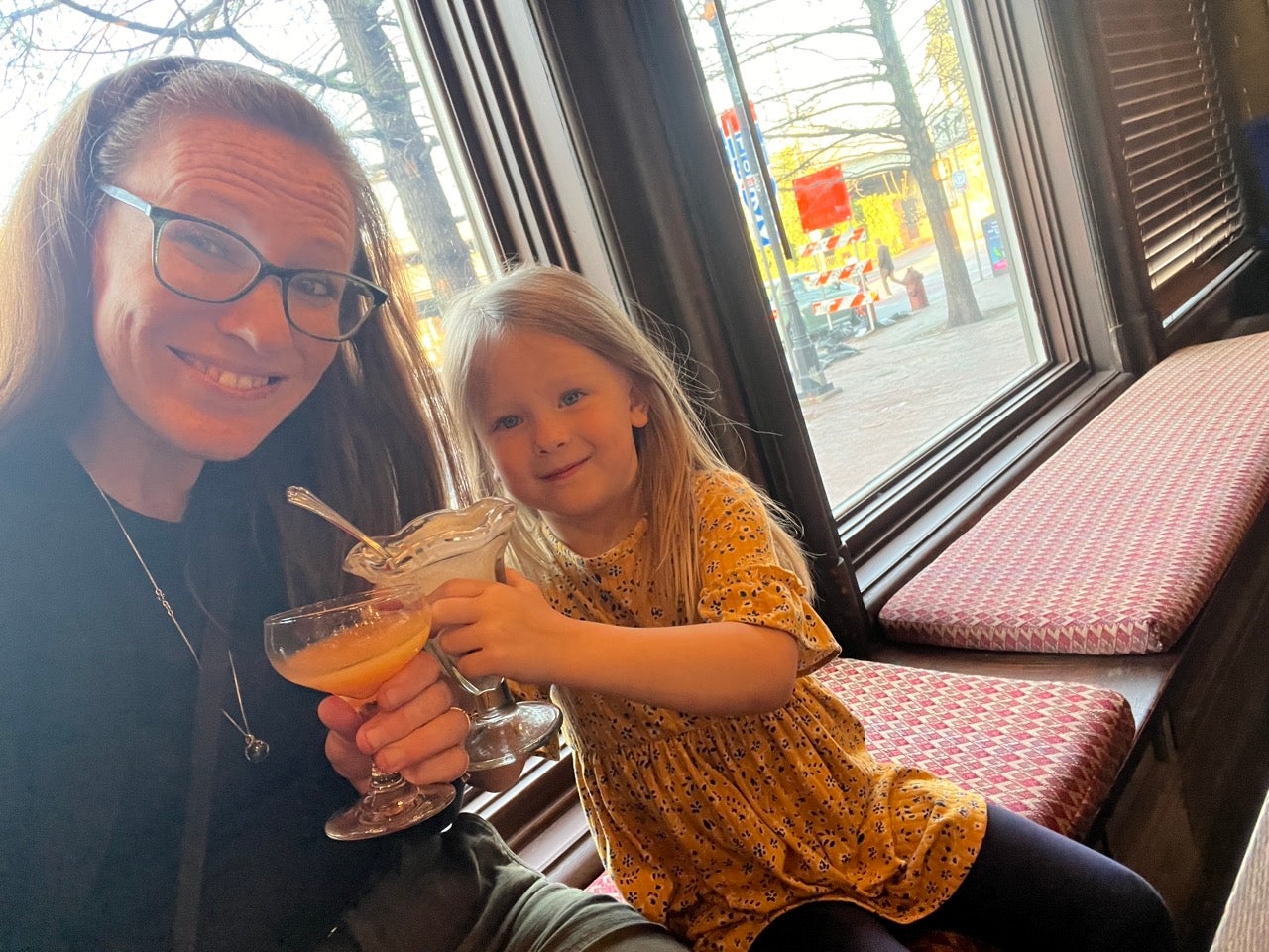 A mom and her daughter toast together at the new Cacoa Pod event space in Philadelphia's Old City.